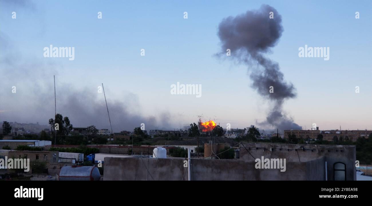 Sanaa, Yemen. 4th Oct, 2024. This photo taken by cell phone shows smoke rising following airstrikes in Sanaa, Yemen, Oct. 4, 2024. The United States Central Command (CENTCOM) said on Friday its forces conducted airstrikes on 15 targets in Houthi-controlled areas of Yemen. Credit: Mohammed Azaki/Xinhua/Alamy Live News Stock Photo