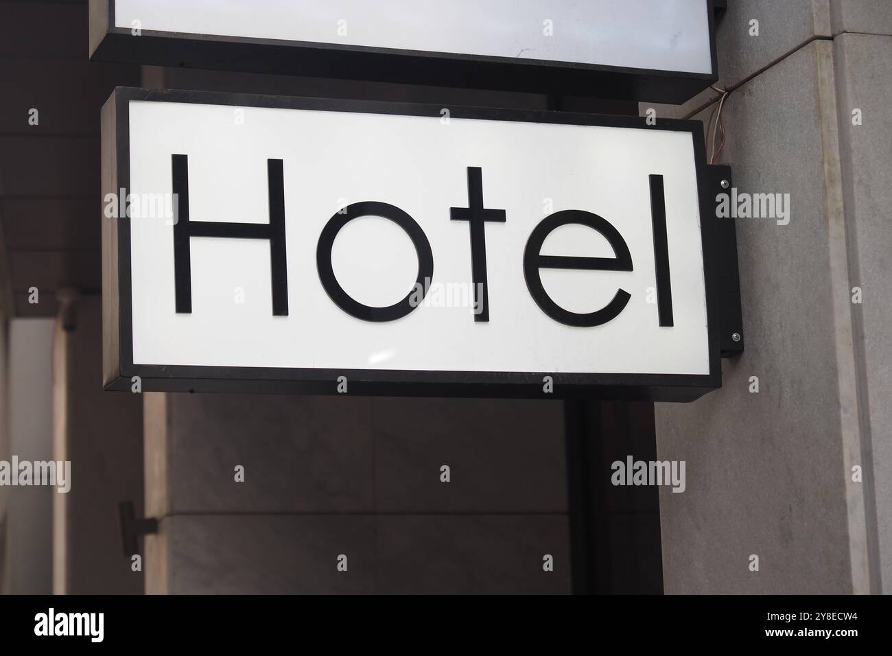 The metallic hotel sign on the wall Stock Photo - Alamy