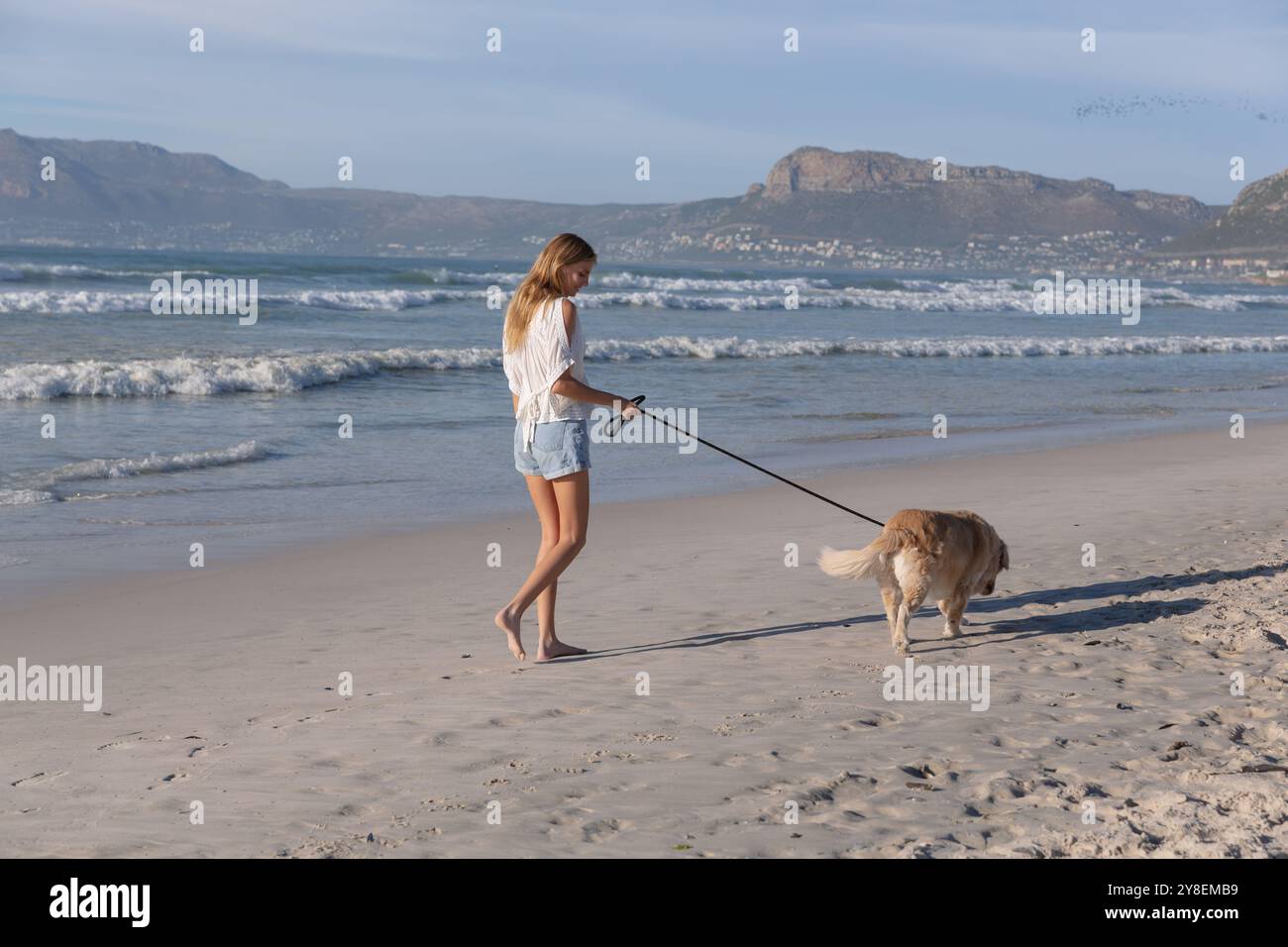 Woman at the beach with her dog hi-res stock photography and images - Alamy