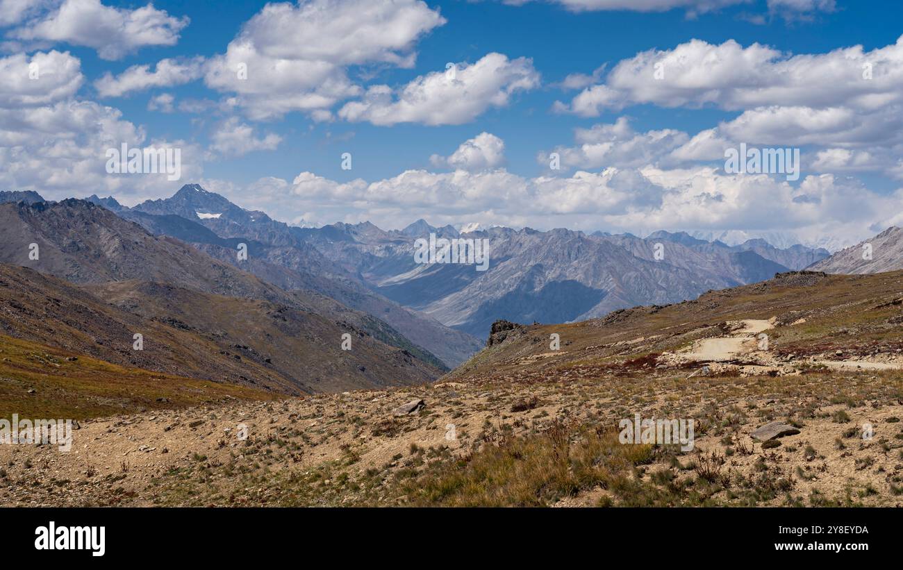 Scenic summer landscape view of high-altitude Deosai Plains with Nanga Parbat in clouds, Astore, Gilgit-Baltistan, Pakistan Stock Photo