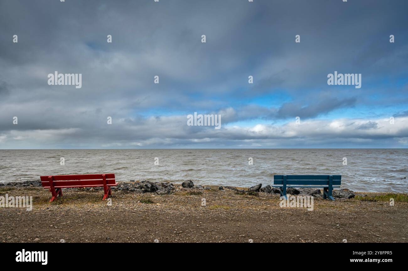 Wooden benches on the shore of the Arctic Ocean at Tuktoyaktuk ...