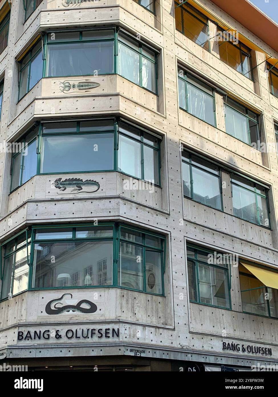 Art Deco tiled animals on facade of Bang and Olufsen showroom at Østergade 18, Copenhagen, Denmark. - Smartphone Captured Stock Image