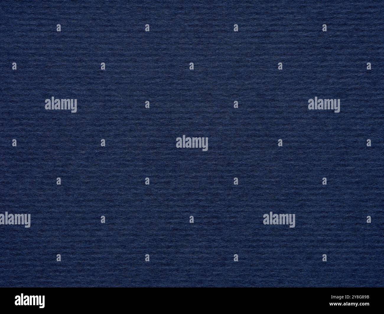 Subtle yet profound, the deep blue paper texture conveys a sense of wisdom and introspective calm Stock Photo