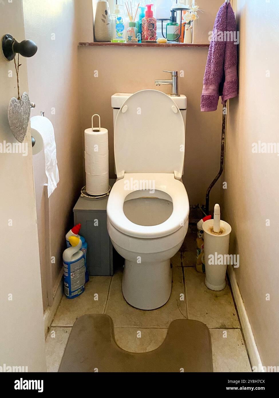 A downstairs toilet with a hand basin built into the cistern of the toilet - Smartphone Captured Stock Image