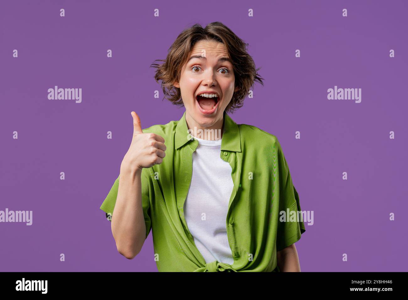 Positive woman with hand sign like, thumbs up gesture. Lady on violet ...