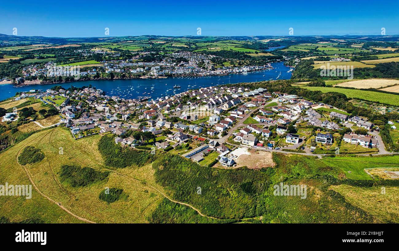 Aerial view of a picturesque coastal village surrounded by lush green ...
