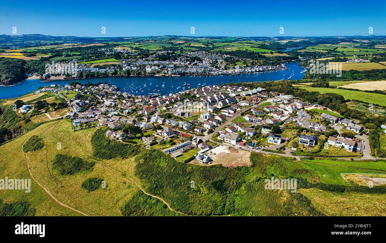 Aerial view of a picturesque coastal village surrounded by lush green ...