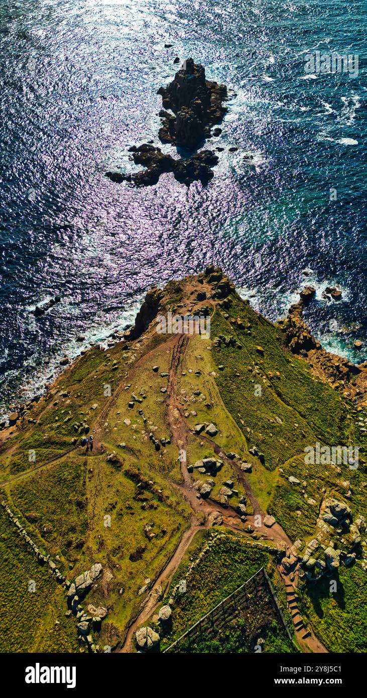 Aerial view of a coastal landscape featuring rocky formations and lush ...