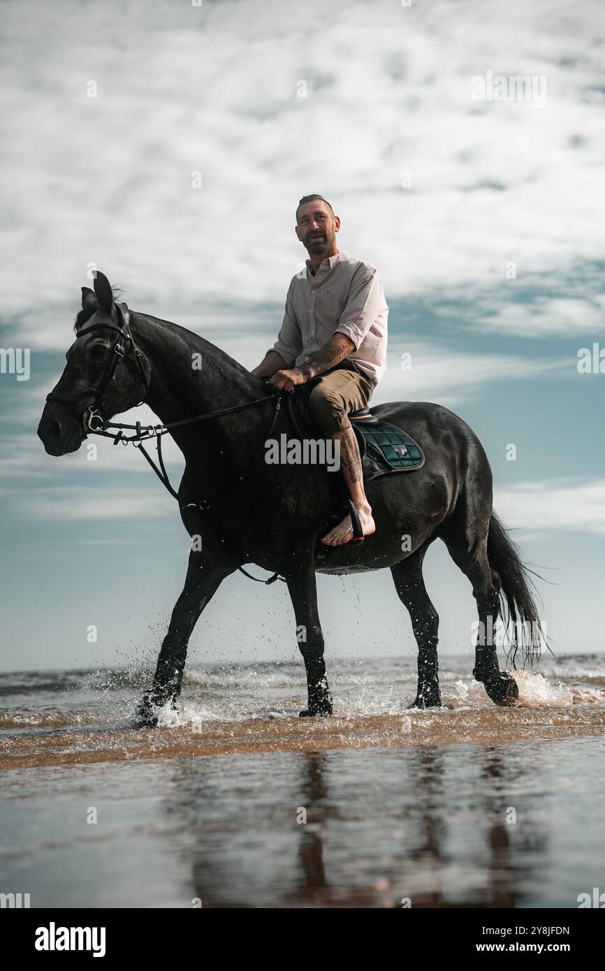 Man riding a horse on a beach, horseback summer cowboy photo Stock ...