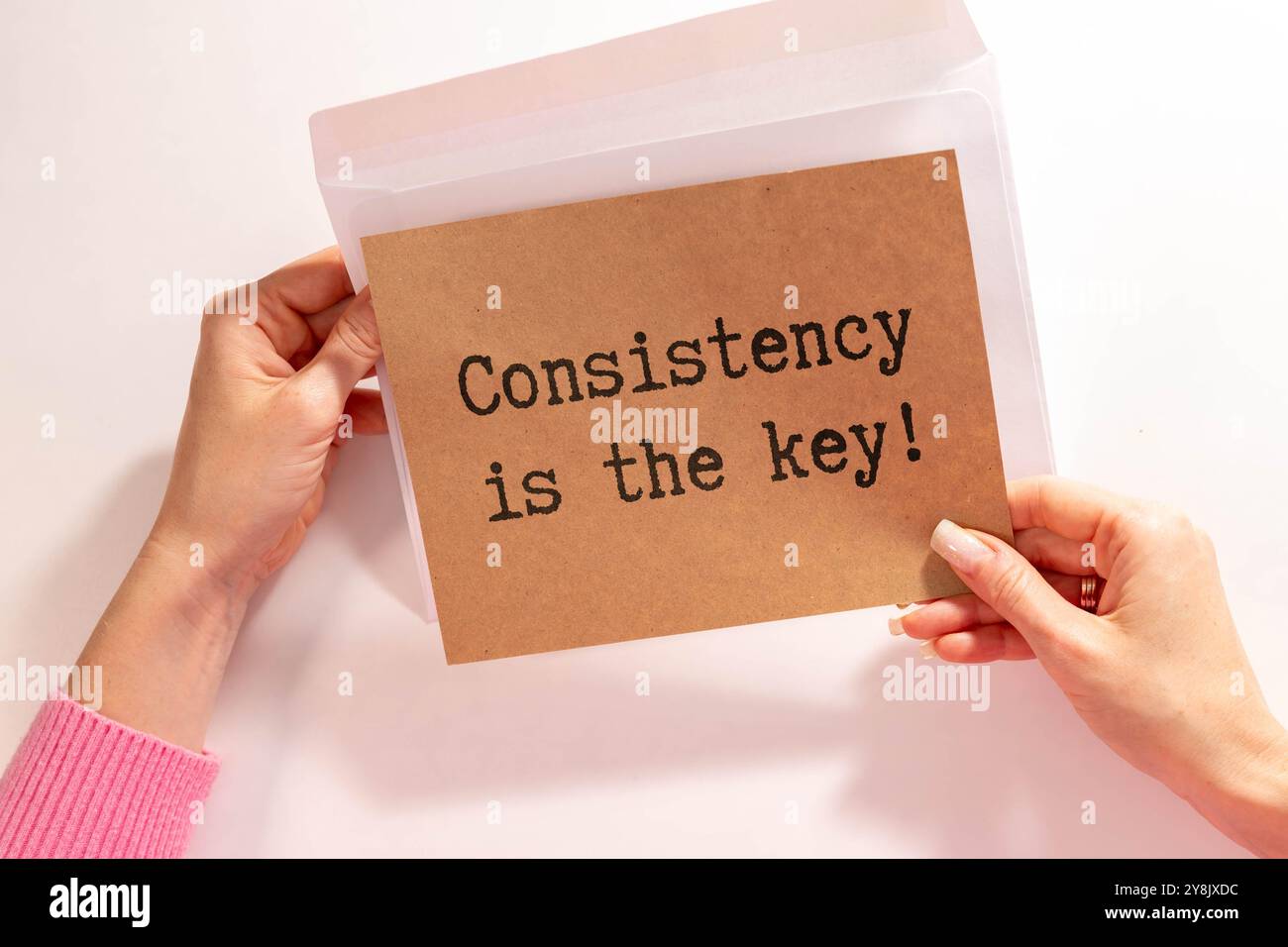 Inspirational Quote - Consistency is the key text written on paper ...