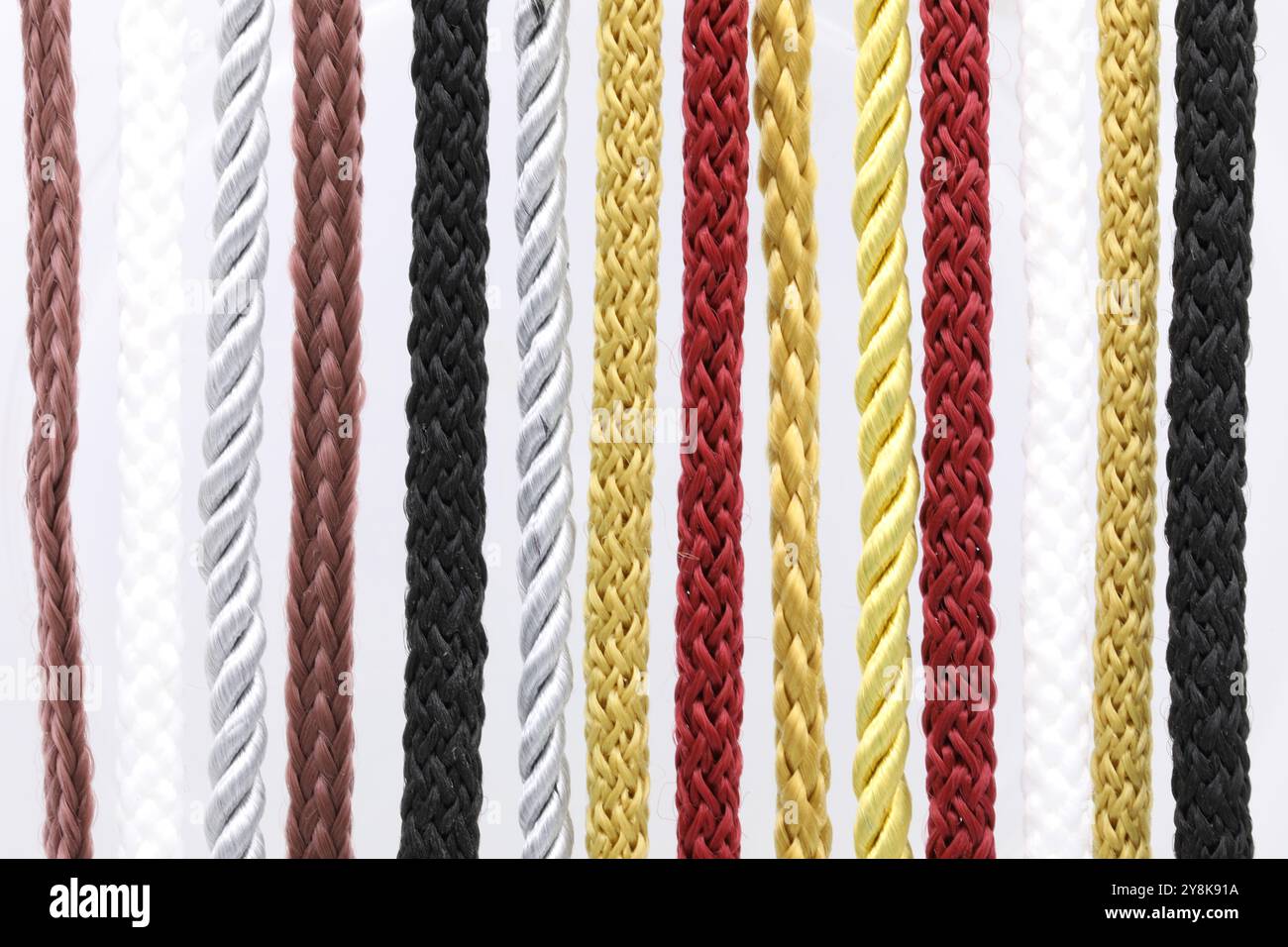 Multi-colored vertical braided rope. Stock Photo
