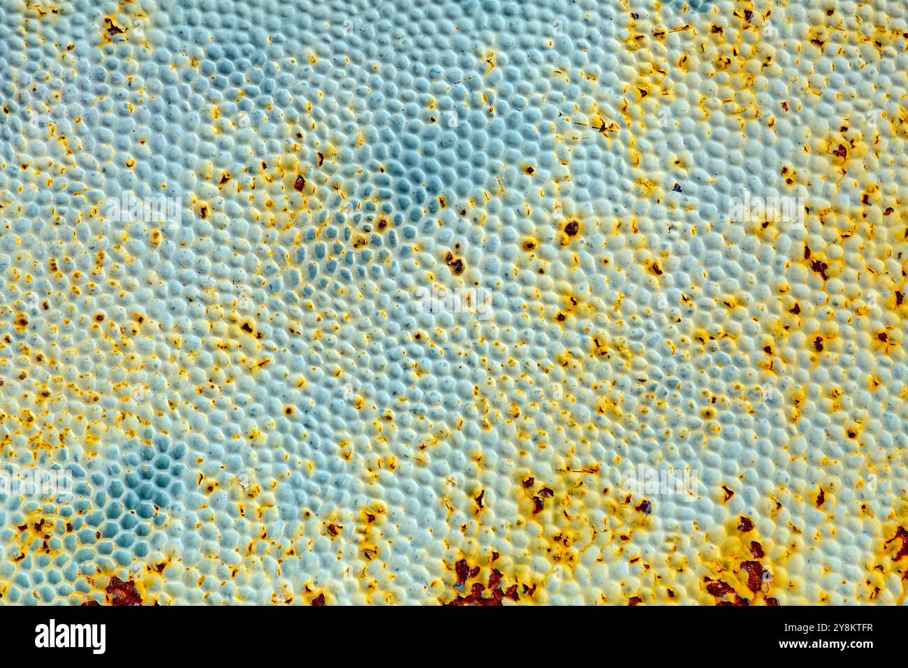 Rusty metal texture close up background with stains and dotty pattern Stock Photo
