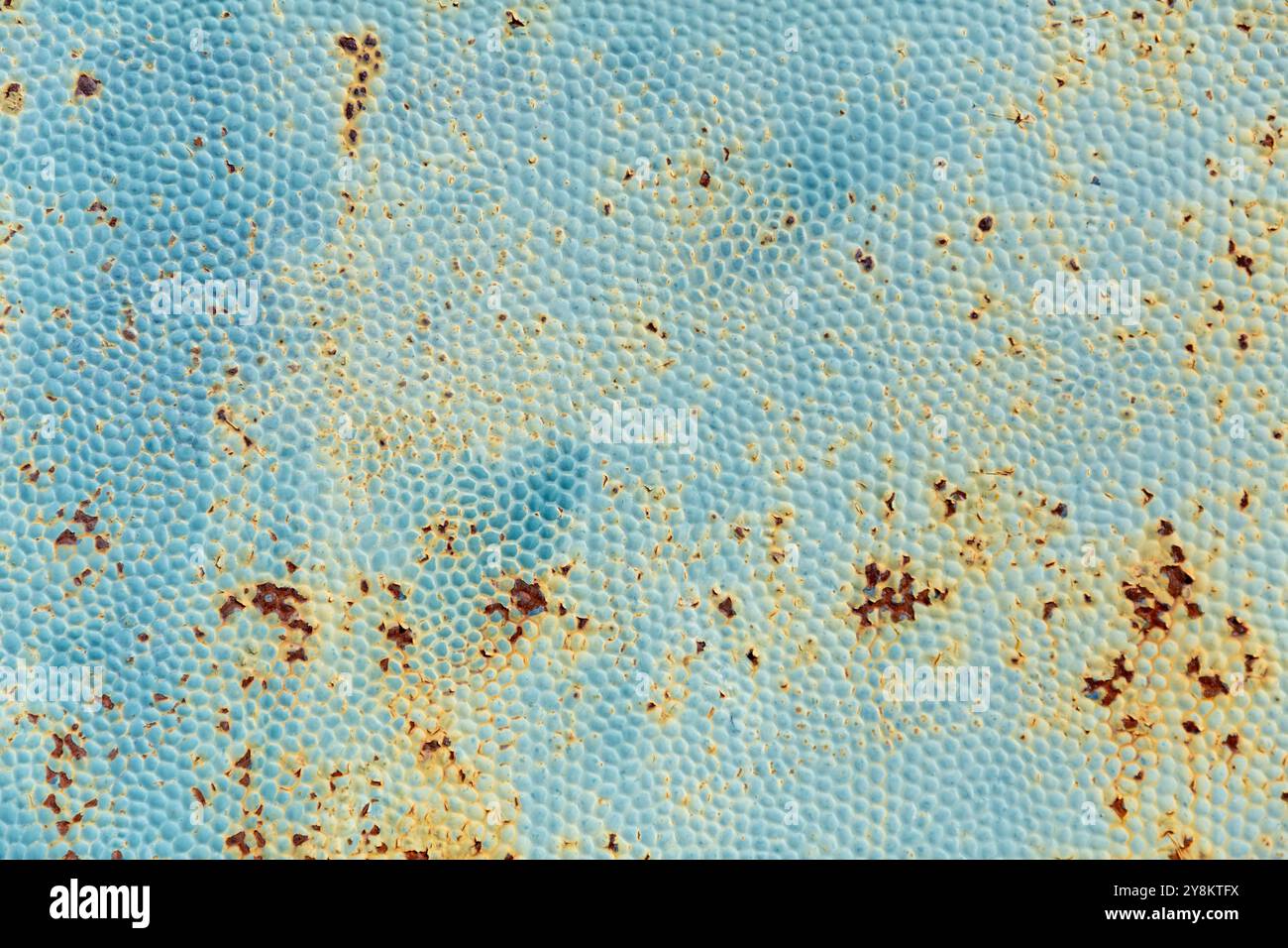 Rusty metal texture close up background with stains and dotty pattern Stock Photo
