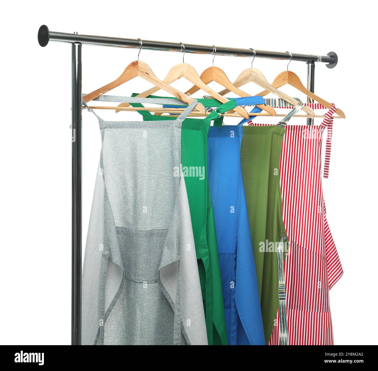 Chef's aprons on clothing rack isolated on white Stock Photo - Alamy