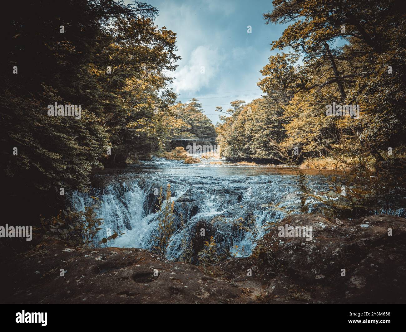 Peaceful river with small waterfall upstream from Ryuzu Falls, Nikko ...