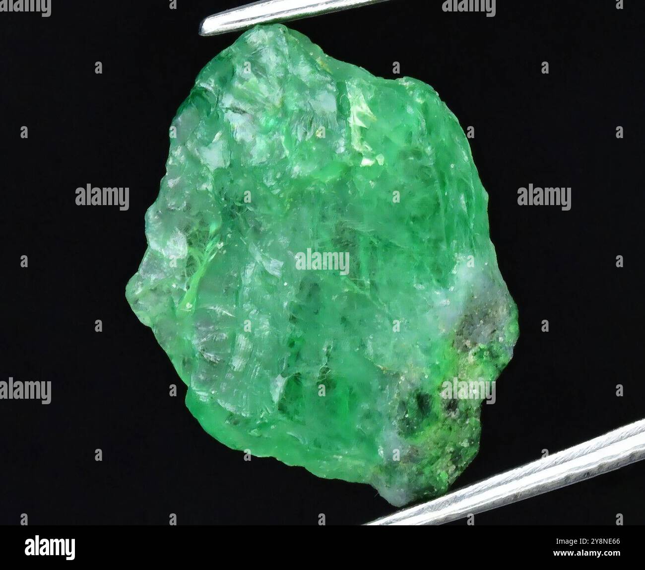 Exquisite Raw Emerald Gemstone Showcased for Maximum Visual Appeal. Stock Photo