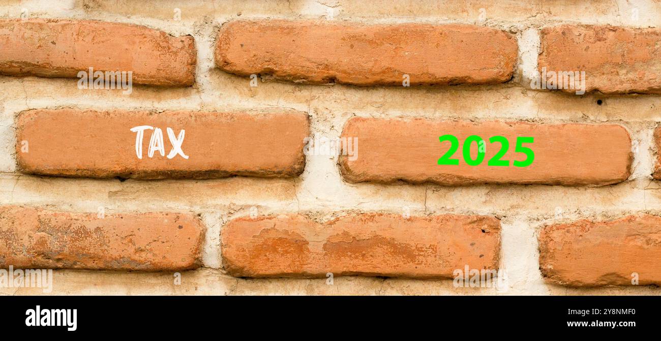 Planning tax 2025 new year symbol. Concept words Tax 2025 on beautiful brown brick wall