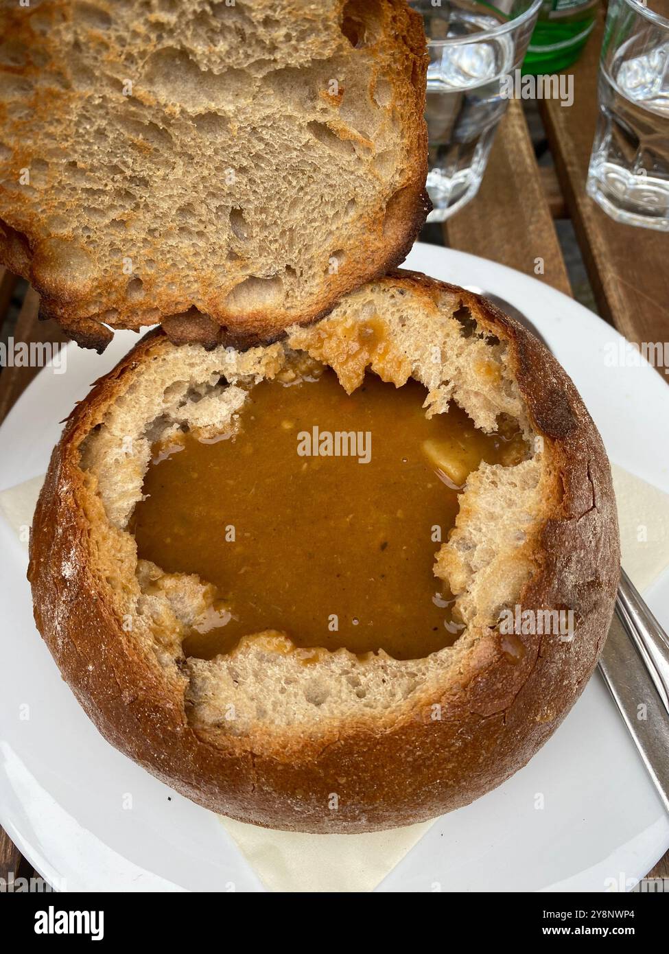 Beef goulash soup in bread bowl served in a Prague city centre restaurant, Czech Republic,2024 - Smartphone Captured Stock Image