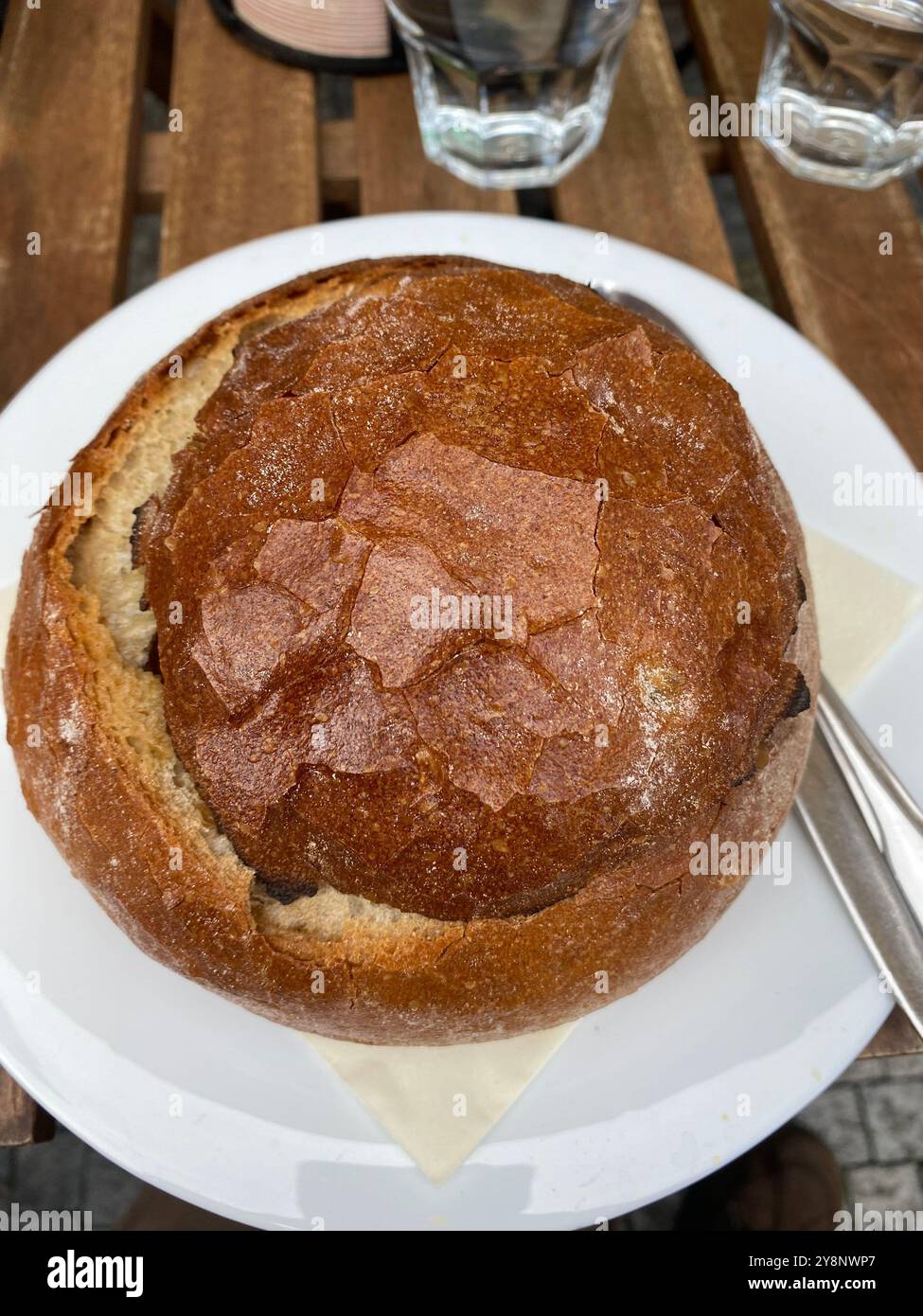 Beef goulash soup in bread bowl served in a Prague city centre restaurant, Czech Republic,2024 - Smartphone Captured Stock Image