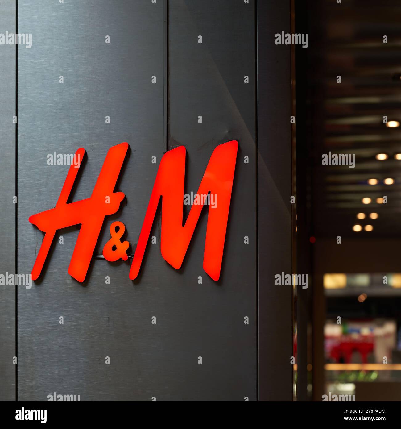 Company logo of the textile discounter H&M in the city center of Leipzig in Germany Stock Photo