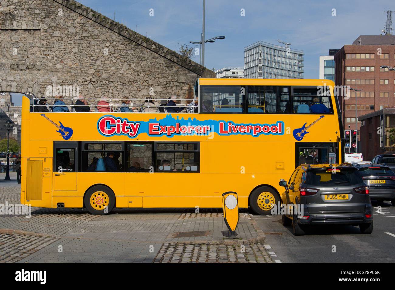 Yellow city tour bus in Liverpool, Merseyside, UK Stock Photo