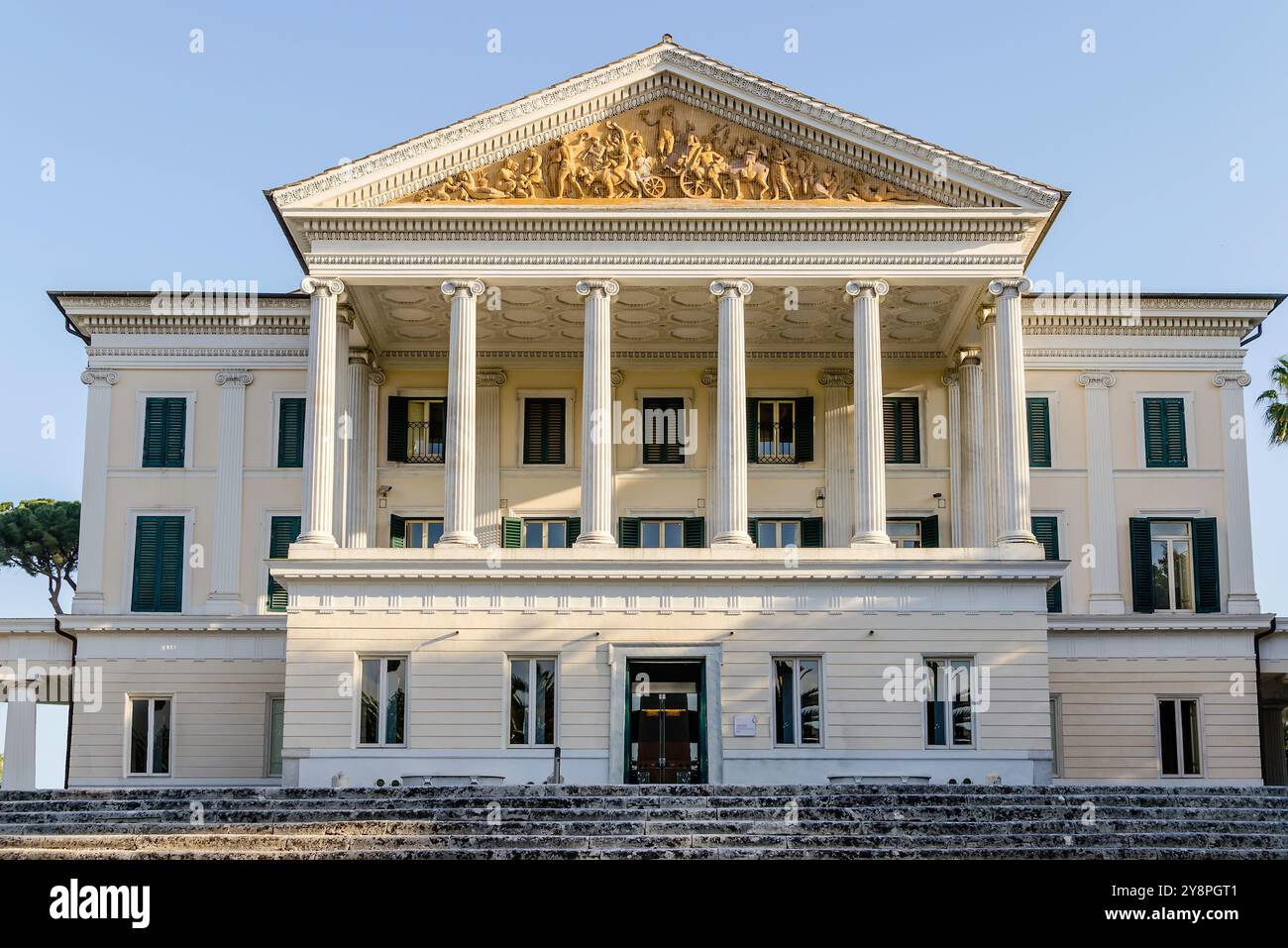 Facade of ancient classic residence in Villa Torlonia, famous public ...