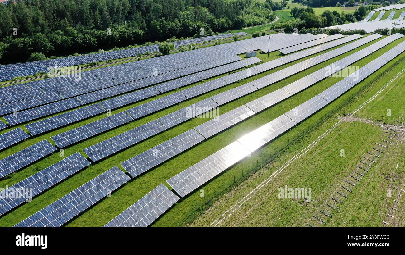 This stunning aerial view captures an expansive solar field, showcasing ...