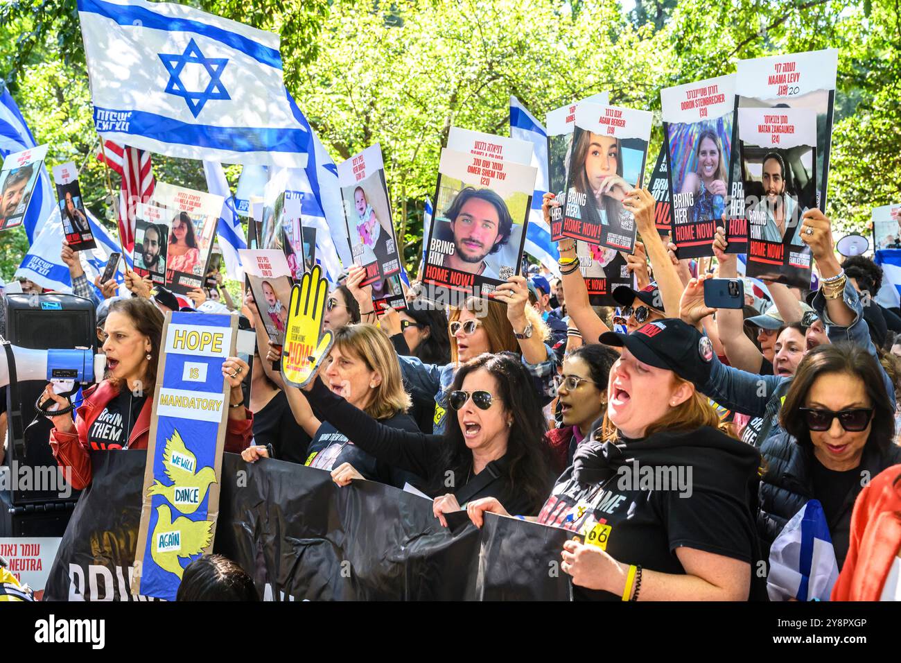 New York, USA. 6th Oct, 2024. People chant 'Bring them home NOW' as families of hostages kidnapped by Hamas on October 7, 2023 mark the 366 days anniversary of their 101 missing relatives with a ceremony in New York's Central Park. Credit: Enrique Shore/Alamy Live News Stock Photo