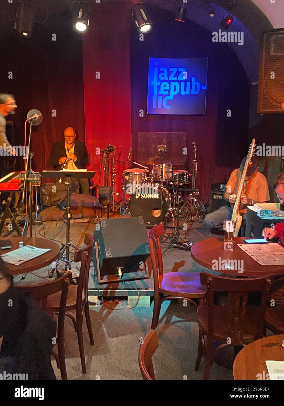 Jazz Republic jazz club interior,  jazz musicians prepare on stage, Prague,Czech Republic,2024 - Smartphone Captured Stock Image
