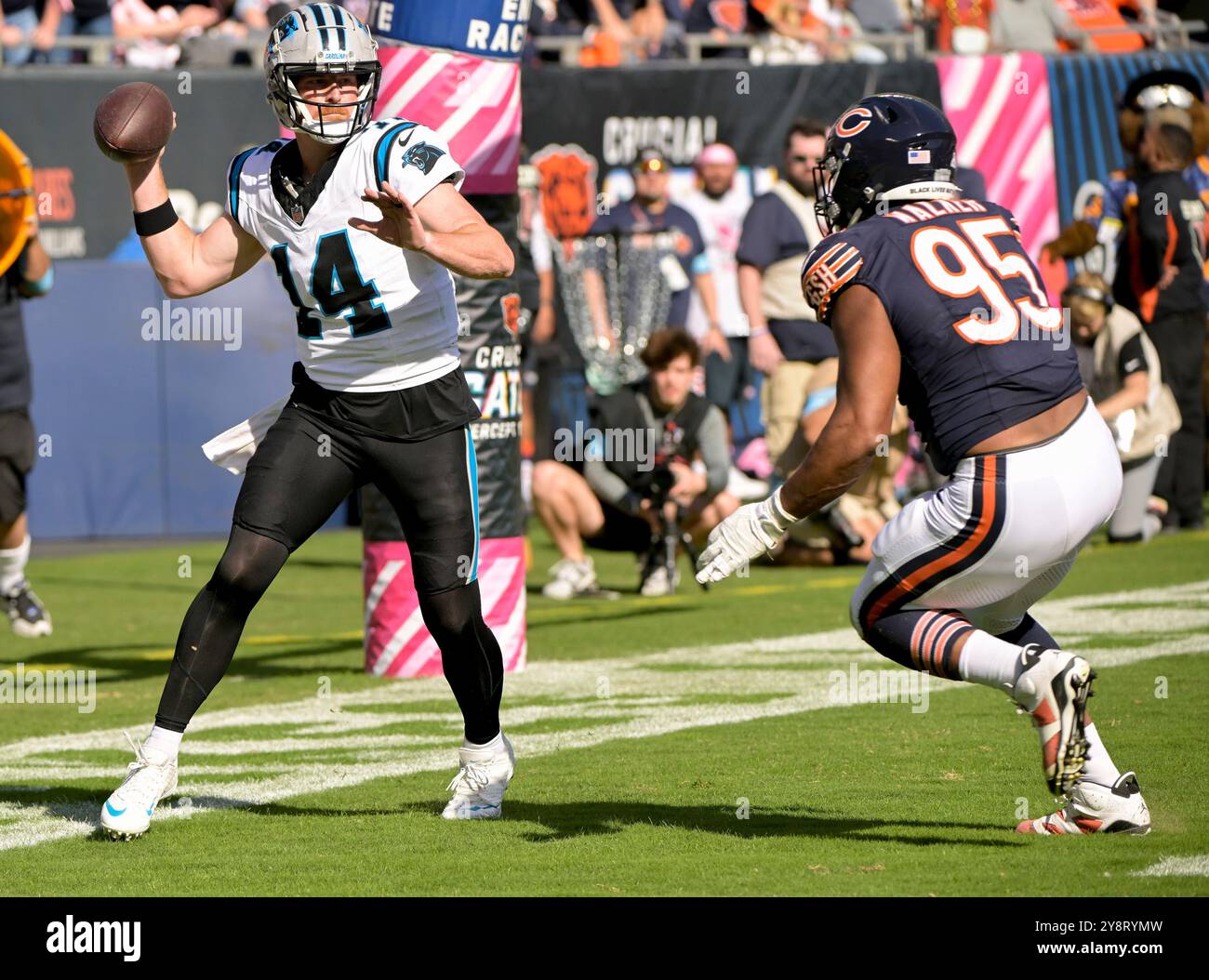 Chicago, United States. 06th Oct, 2024. Carolina Panthers quarterback Andy Dalton (14) scoops up the loose ball in the end-zone and was able pass off before being tackled by Chicago Bears defensive end DeMarcus Walker (95) at Soldier Field in Chicago on Sunday, October 6, 2024. The Bears defeated the Panthers 36-10. Photo by Mark Black/UPI Credit: UPI/Alamy Live News Stock Photo