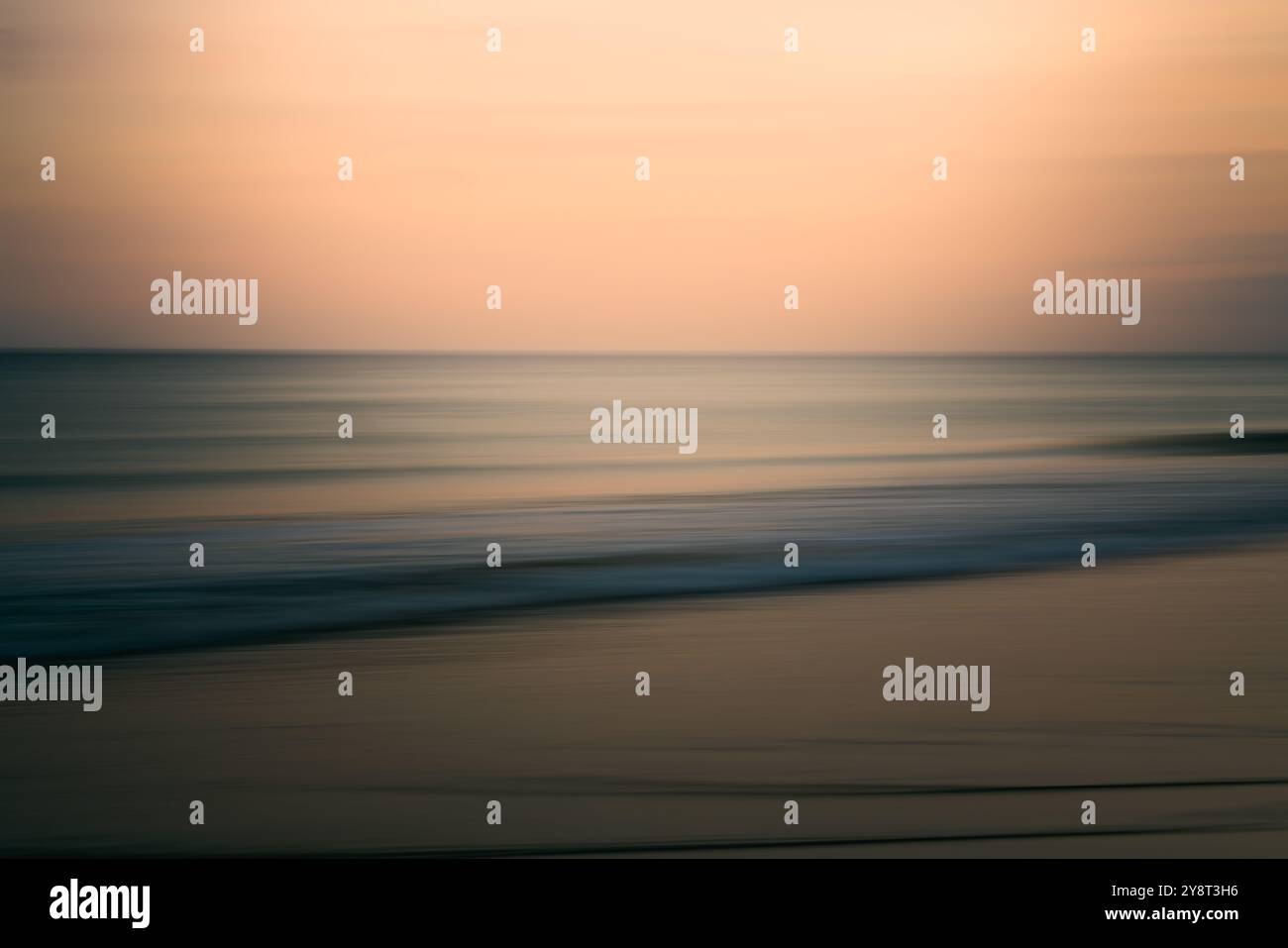 Evening ocean scene with soft waves and a serene horizon, abstract seascape Stock Photo