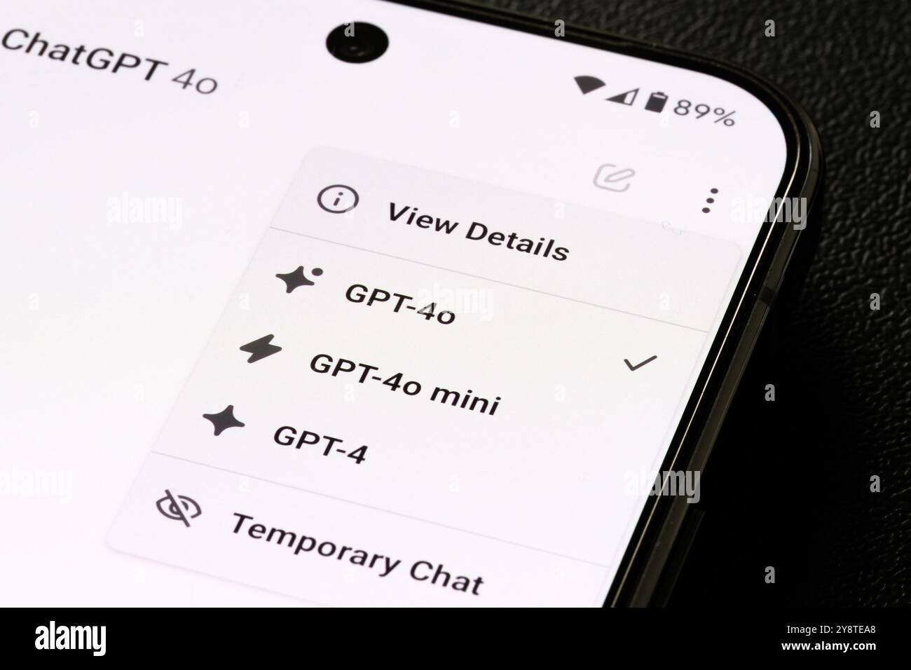 Pixel 9 pro smartphone screen showing ChatGPT's interface, highlighting model selection options: GPT-4, GPT-4o, Gpt4o mini, and a 'Temporary Chat' mod Stock Photo