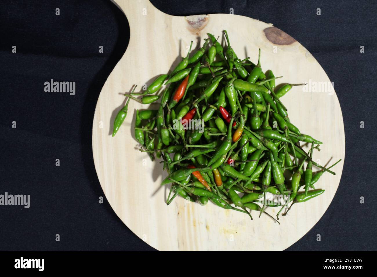 small green chilli with black background Stock Photo - Alamy