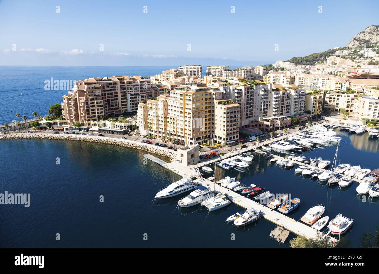 Montecarlo, Monaco, August 2022: panoramic view of the Fontvielle port with blue sky and sea, Europe Stock Photo