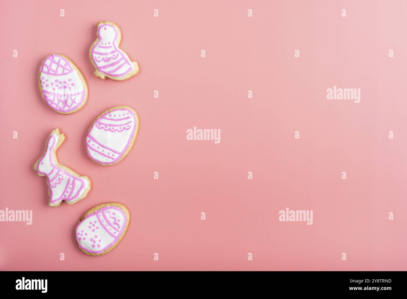 Homemade Easter cookies on pink background flat top view Stock Photo