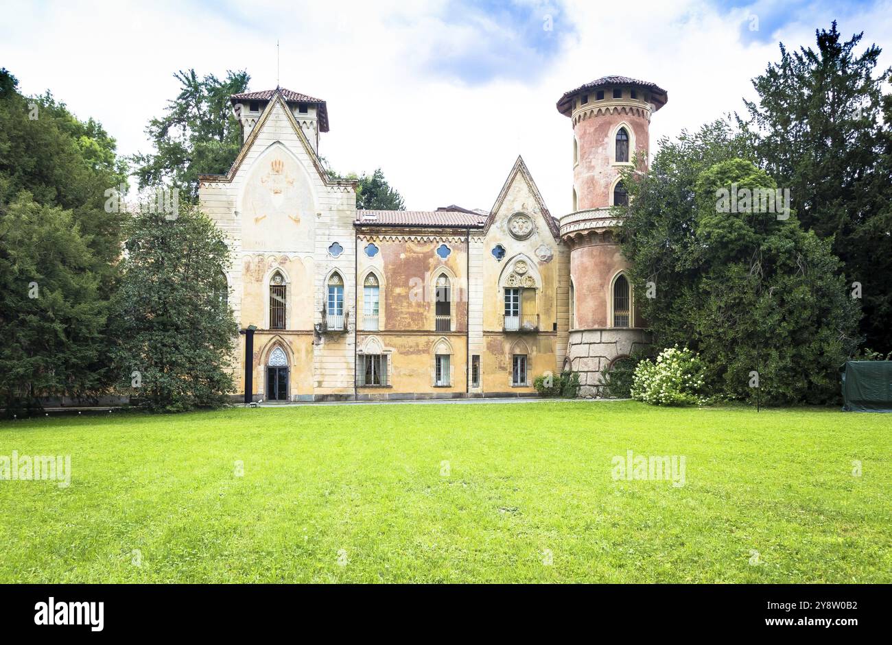 ITALY, MIRADOLO, CIRCA AUGUST 2020: gothic design castle located in an Italian garden, full of mystery, with sunset light Stock Photo