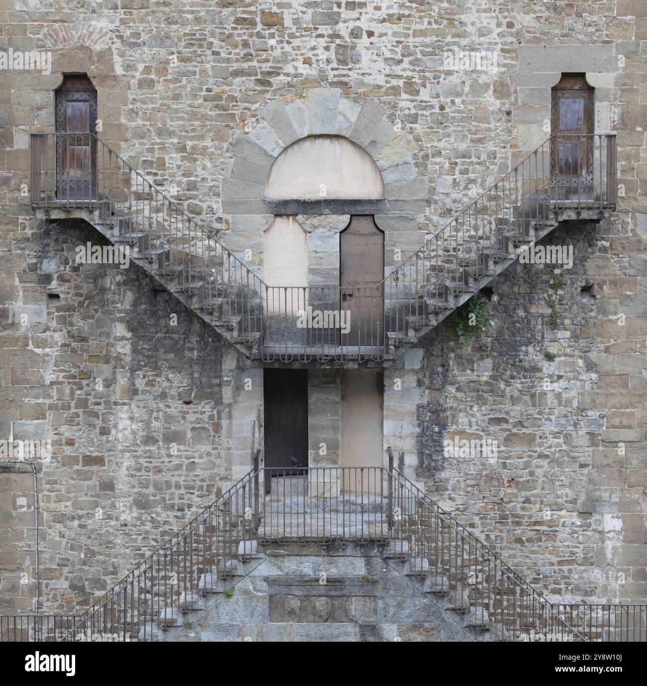Exterior of antique building with Escher architecture style. Simmetry and geometric perspective Stock Photo
