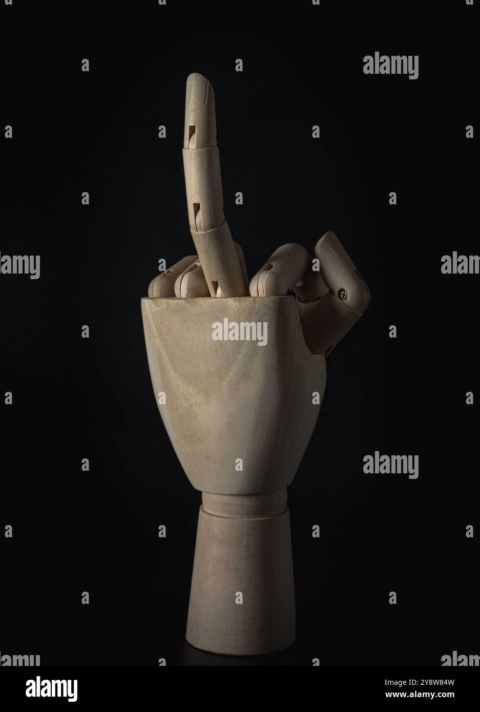 Turkish Rude Finger Wooden hand of mannequins with raised middle finger up on dark ...
