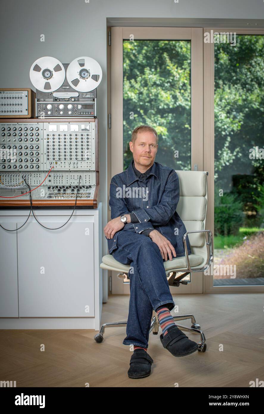 Max Richter with Synthesizer and Revox in his Oxfordshire studio / United Kingdom. Stock Photo