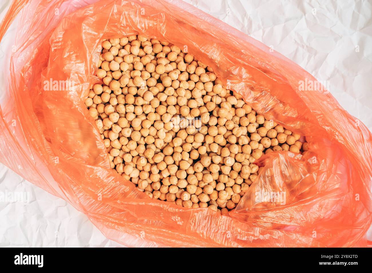 Plenty of chickpea in a plastic bag, top view with selective focus Stock Photo