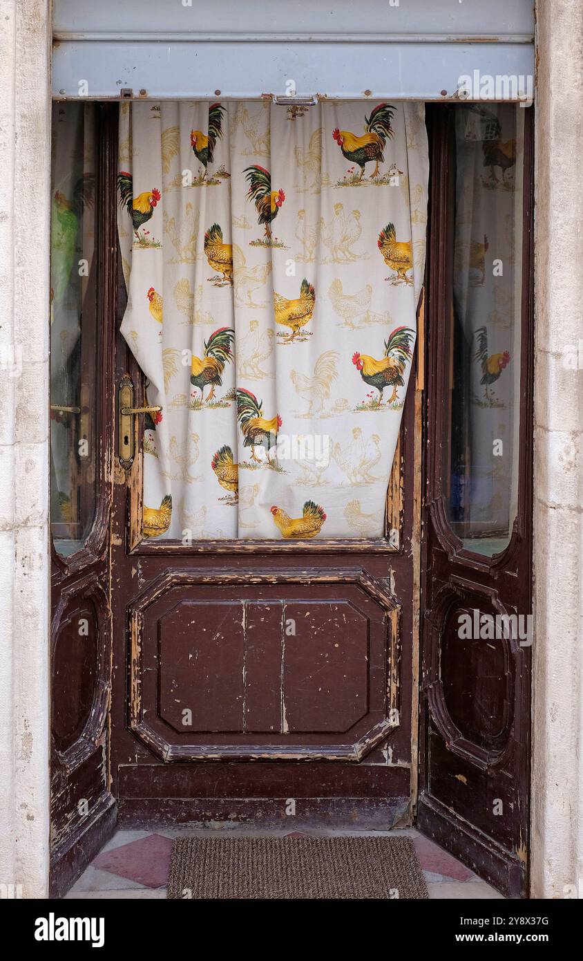 chicken curtain fabric in door window, puglia, italy Stock Photo