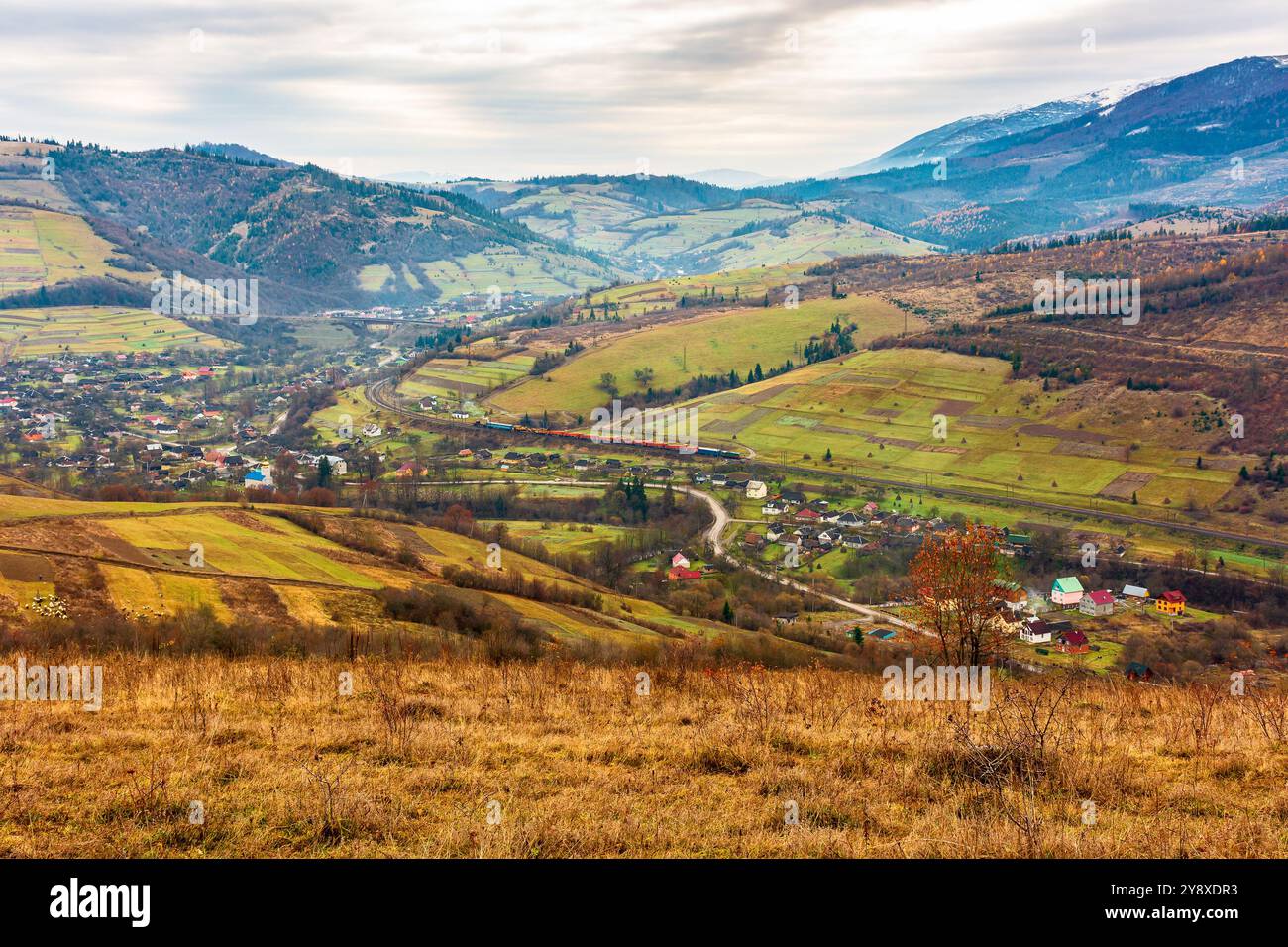rural mountain landscape in november. late autumn scenery with snow capped peaks of carpathian mountains. fall season in ukraine Stock Photo