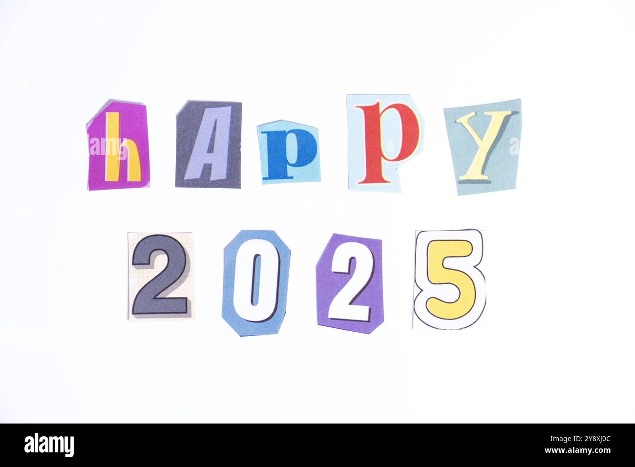 Phrase Happy 2025 spelled in cut out newspaper style typography, isolated on white background. Stock Photo