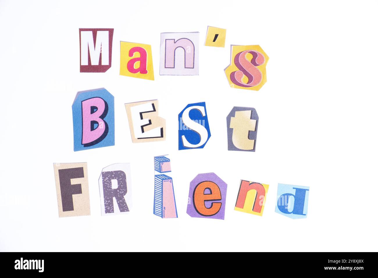 Phrase Man's Best Friend spelled in cut out newspaper style typography isolated on white background. Stock Photo