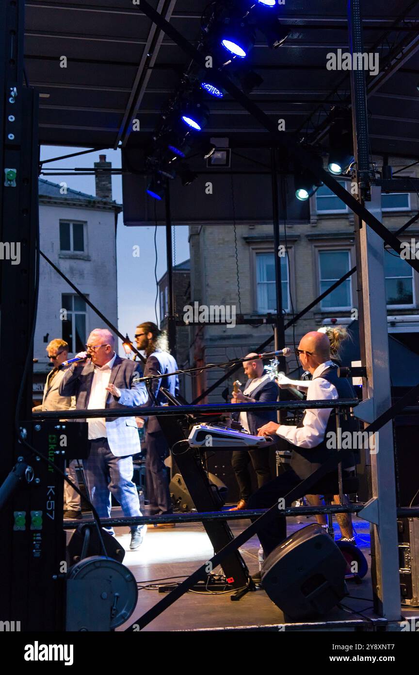 Band performing on stage at the Reggae and Ska festival in the marketplace in Boston Lincolnshire Stock Photo
