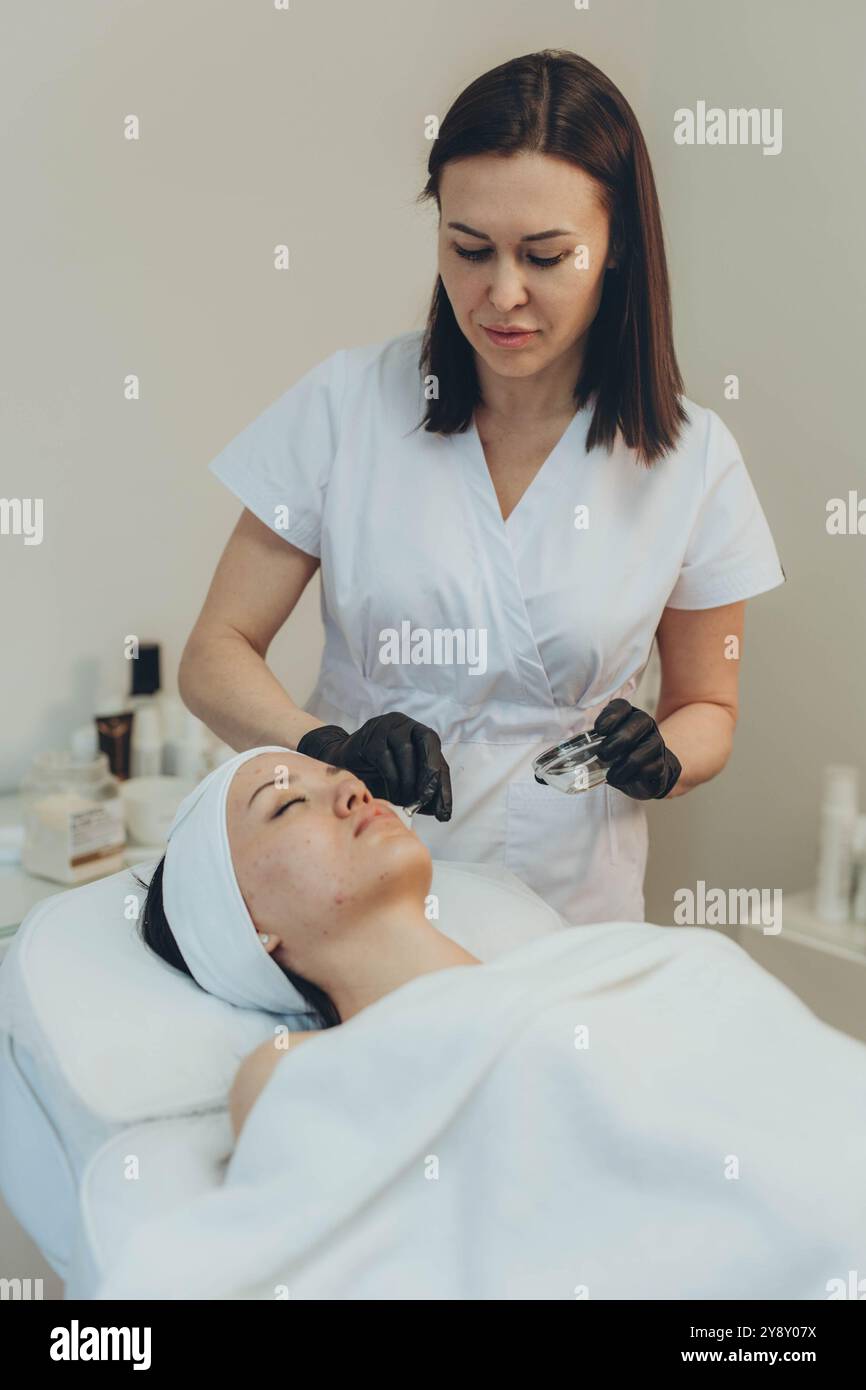Girl doing cosmetic procedures hi-res stock photography and images - Alamy
