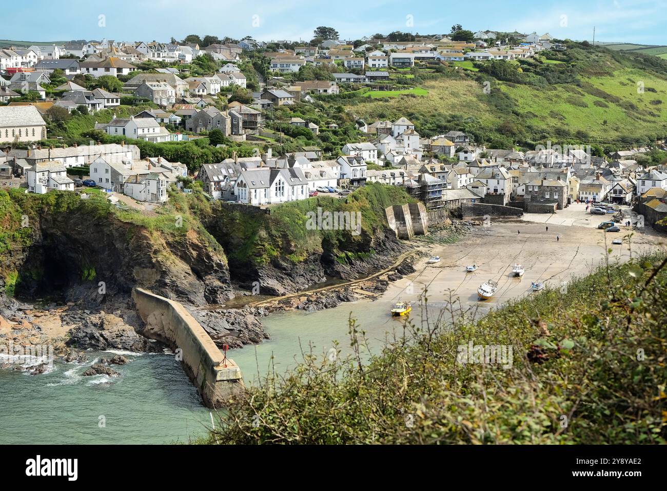 Port Isaac fishing village harbour and sea wall, at low tide, on the North Cornish Coast, Cornwall, UK. Stock Photo