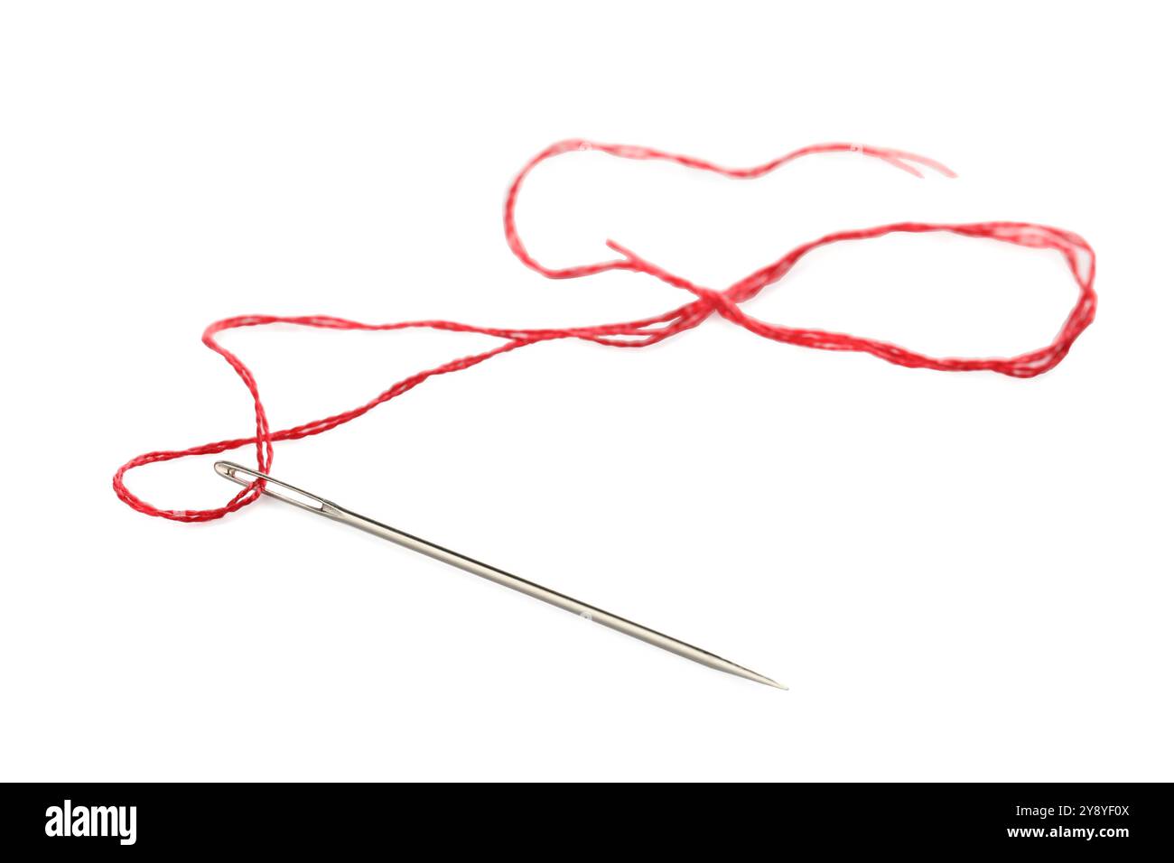 Sewing needle with red thread isolated on white Stock Photo - Alamy