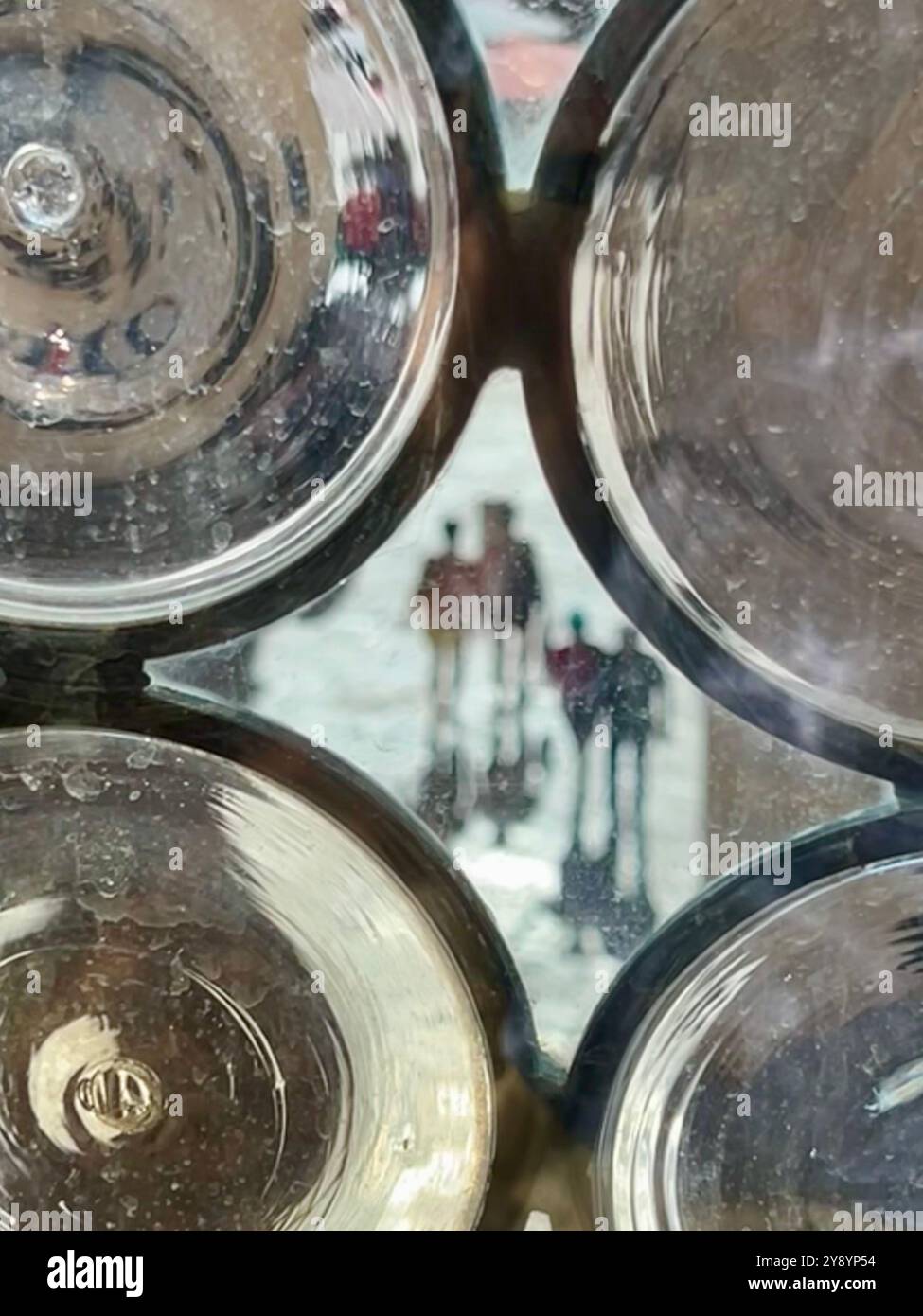 Figures in abstract on street seen through old window or Rector's Palace in Dubrovnik, Croatia - Smartphone Captured Stock Image