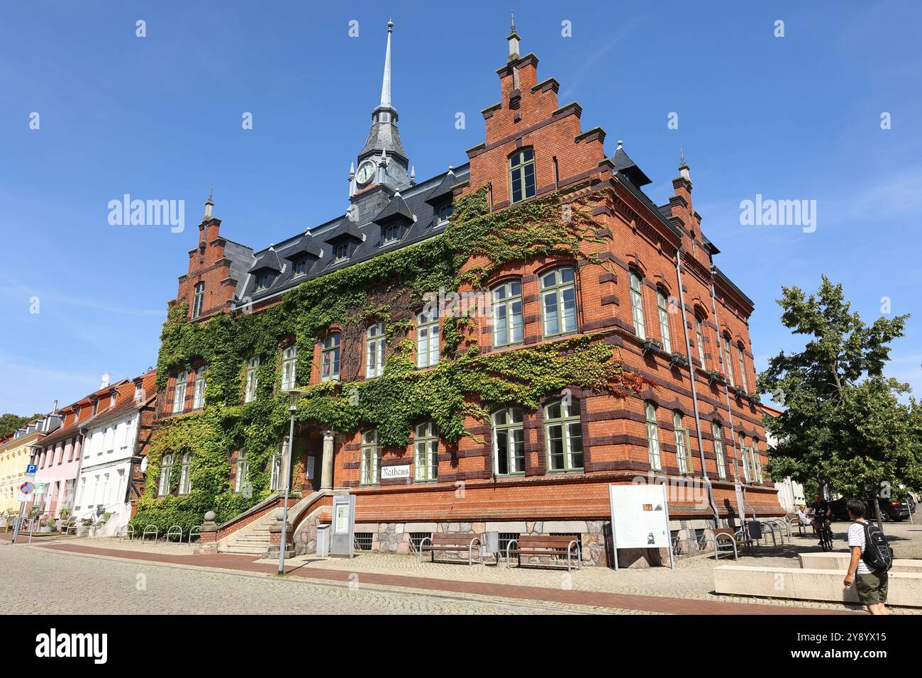 The town hall building in Plau am See is overgrown with ivy Stock Photo